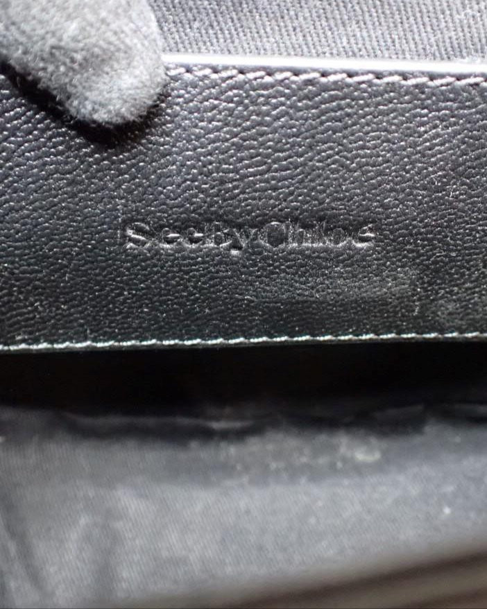 Close-up of a textured surface with 'Skechers' branding.