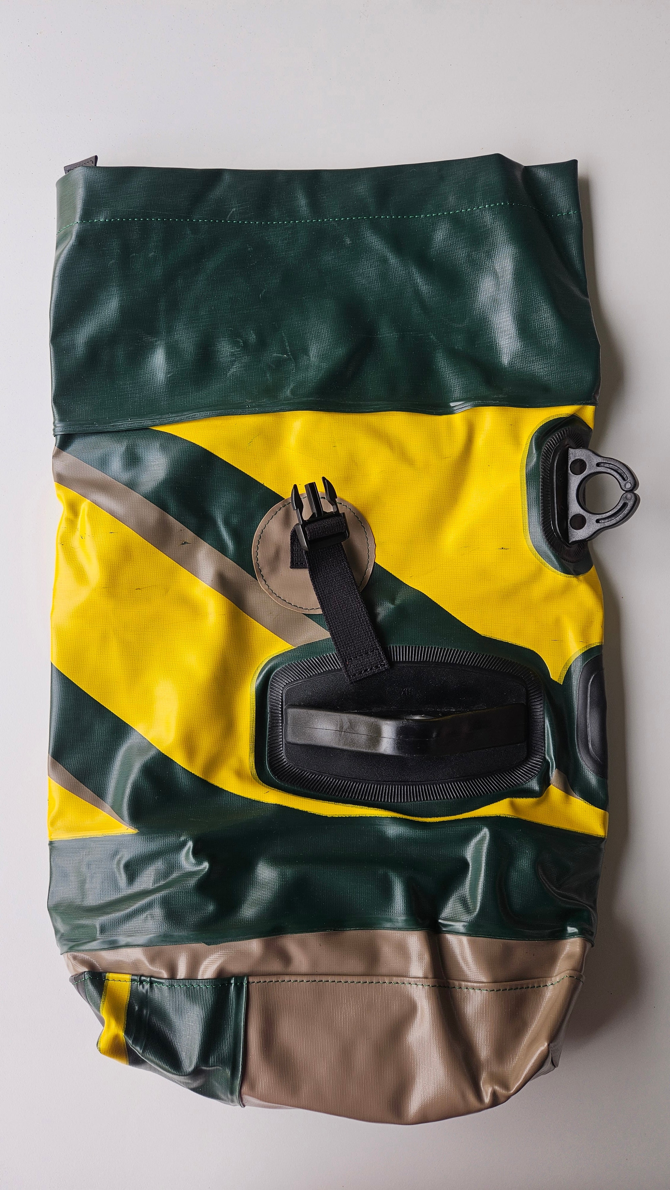 Green and yellow jacket with a logo on a white background