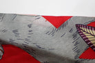 Close-up of fabric with red and gray pattern from Hermes secondhand TWILLY