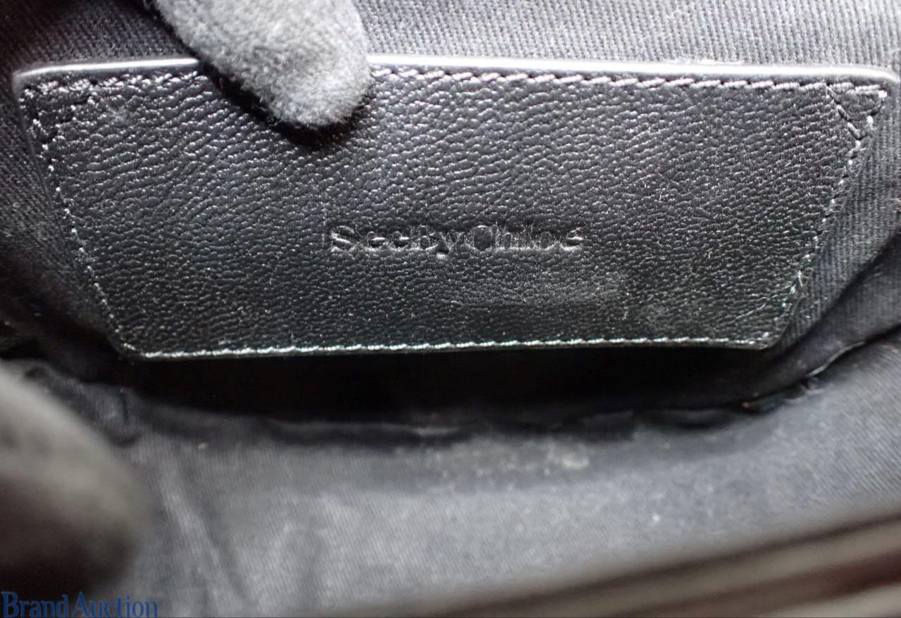 Close-up of a textured surface with 'Skechers' branding.